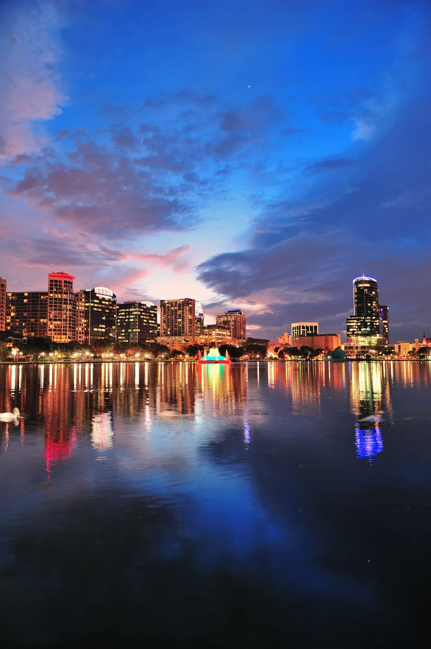 Orlando skyline reflected in Lake Eola at dusk